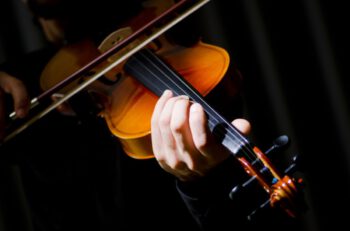 depositphotos_7968749-stock-photo-young-violin-player-playing